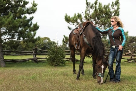 Cowgirl and Companion - saddle, fence, horse, trees, cowgirl, sunglasses, grass, blonde