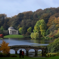 Visitors view the autumn foliage and colours in the gardens and estate at Stourhead in southwest Britain, on October 21, 2016.