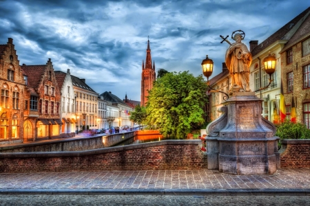 Statue in Bruge, Belgium - sky, houses, clouds, city, church, hdr