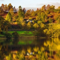 House on autumn lakeshore