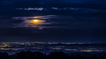 Moon clouds and city