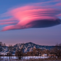 Pink Clouds in Winter Landscape