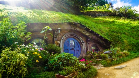 Hobbit Hole - nice, sunshine, snapshot, movie, photography, foto, fantasy, pretty, hobbit hole, film set, green, sunny, grass, the hobbit, beautyfull, beautifull, hobbit, lovely, movie set, tiny, film, blue, hole, flowers, photo, lord of the rings, small