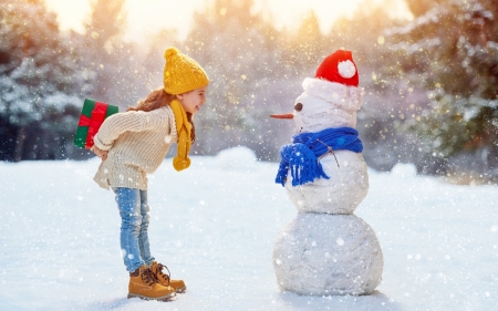 Guess what?! - snowman, craciun, gift, girl, winter, child, copil, scarf, christmas, white, yellow, red, blue, snow