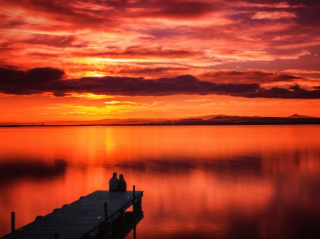 Couple at Red Horizon - pierce, horizon, people, couple, sunset, mountains, pair, clouds, mirror