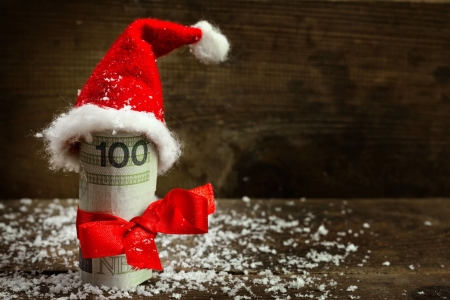 Gift money with red ribbon and Santa cap - hat, money, winter, cap, christmas, santa, holiday, funny, red, ribbon, rich, gift