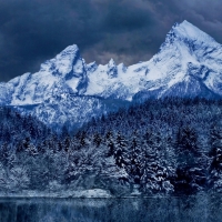 Dark Clouds over Winter Mountain Forest