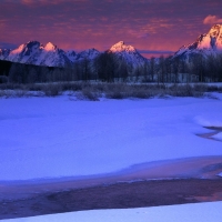 Pink Clouds over Snowy Winter Mountains