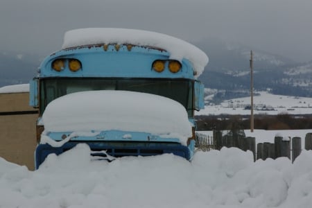 Bus covered in snow; Teton Valley, Idaho