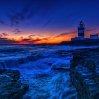 Lighthouse in Sunset Horizon