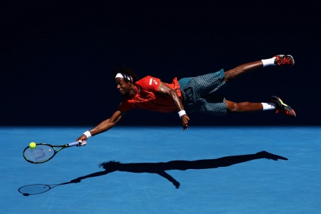 Gael Monfils dives for a shot