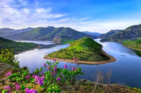 Green mountain surrounded by body of water - sky, body, mountain, water, spring, nature, view, river, beautiful, green, flowers