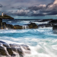 Foamy Rocky Ocean and Lighthouse