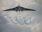 Vulcan Bomber With The Red Arrows