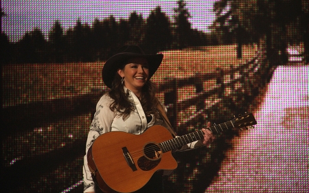 Cowgirl By The Fence. . - women, fun, female, hats, brunettes, western, fence, girls, guitar, Carin Mari, cowgirl, style, outdoors, country music, ranch