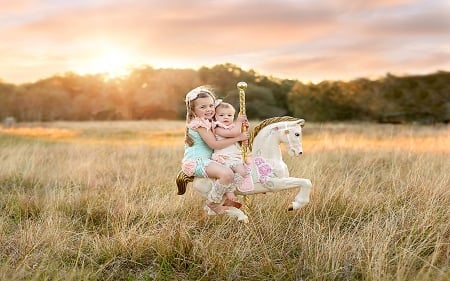 Starting Young. . - style, girls, western, hobby horse, ranch, outdoors, brunettes, cowgirl, children, fun, kids