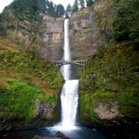 bridge under a waterfall