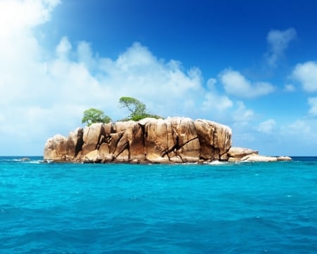 Rocky Island in the Middle of the Ocean - clouds, rocky, island, sea, ocean, nature