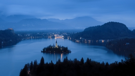 Lake Bled at Dusk - clouds, trees, fog, blue, island, city, night, forest, nature, lights, mountains