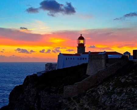 Lighthouse at Sunset - nature, sky, lighthouse, clouds, sunset, sea