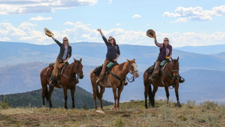 Out For a Ride - sky, trees, cowgirls, mountains, sunglasses, hats, horses, chaps, clouds