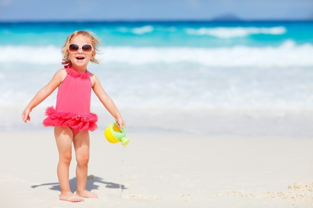 Little girl on the beach - summer, blue, beach, girl, sea, pink, copil, sand, child, little, sunglasses