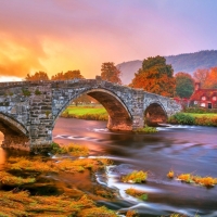 Stone Bridge over Flowing River