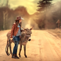 Cowgirl with donkey