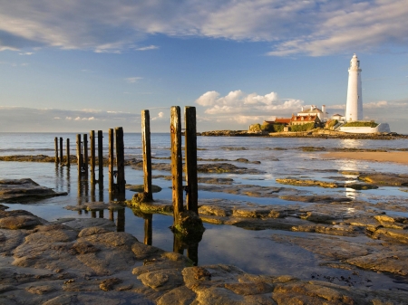 Lighthouse at Sunset - nature, lighthouse, clouds, sunset, sea, rocks