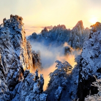 Sunrise over Snowy Winter Mountains