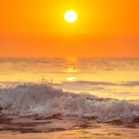 Foamy Ocean Waves at Sunset