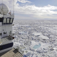 Icebreaker sails through sea ice