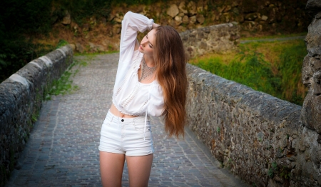 Pretty Woman out for a Walk - blonde, shorts, fence, model