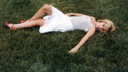 Splendour in the Grass.....Ashley Tisdale - arm bracelets, lying on the grass, white dress, high heels, blonde