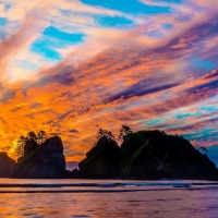 Sunset behind a rocky island
