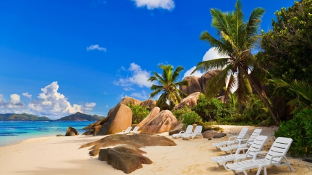 La Digue Island, Seychelles - beach, lounger, sea, rocks, sky