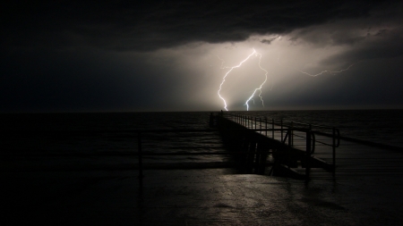 Lighting on the Pier - storm, skies, ocean, dark, pier, lighting