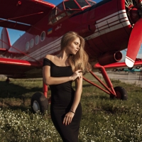 Model Posing with a Airplane