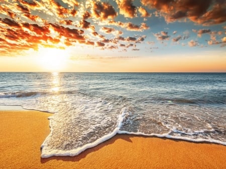 Orange Clouds Over the Sea at Sunset