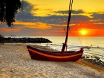 Sailboat on a Beach at Sunset