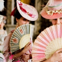 Ladies With Hand Fans