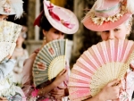 Ladies With Hand Fans