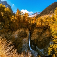 Waterfall in Autumn Mountains