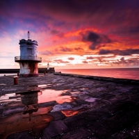 Lighthouse Reflections at Twilight