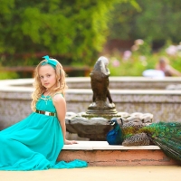 Little girl and peacock