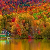 House on autumn lake