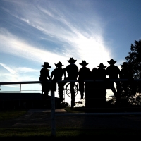 Silhouette of cowboys and cowgirls