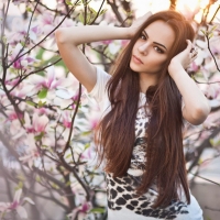 girl between the blossoms