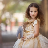 Little girl with hand fan