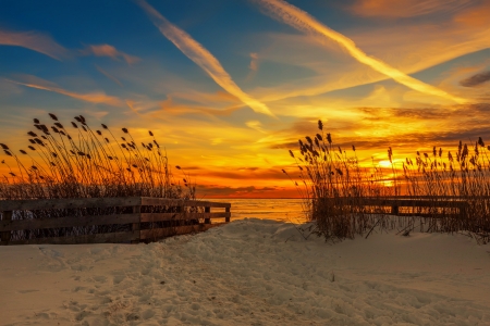 Snowy beach at sunset